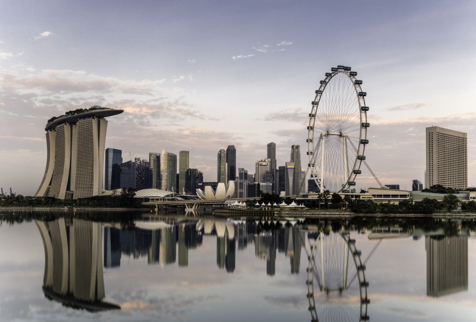 Singapore skyline at dawn, showing the Marina Bay Sands and the Flyer.